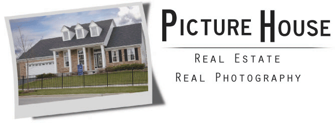 A polaroid picture of a ranch home